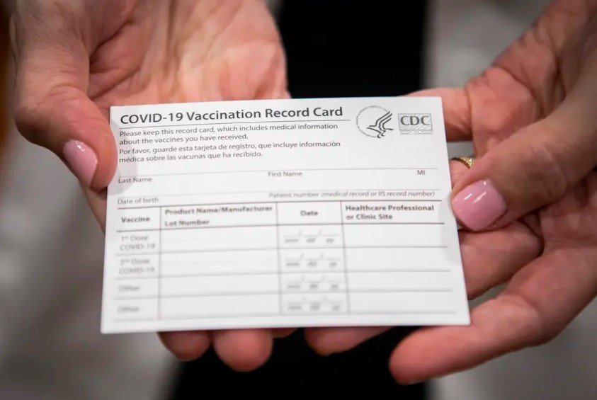 A COVID-19 vaccine registration card. Gov. Greg Abbott will sign a bill into law that will punish businesses that require proof of vaccination from customers. Abbott's signature means that businesses that require so-called vaccine passports can't get state contracts and could lose state licenses or operating permits.